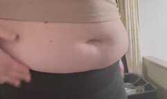 Trying on old, stretched out shorts over my expanding, stretched out belly