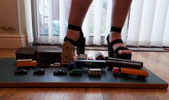 Giantess Lou crushes buildings, cars, trucks & train coaches in big black chunky heels ground view