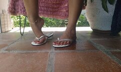 Soles, flip-flops, pronounced arches, flip-flops hanging down, crossed legs (3)