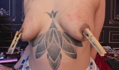 beautiful tits with many clothespins