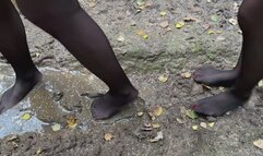 Two girls in mud, muddy knee high white socks, black stockings in mud, white socks in mud