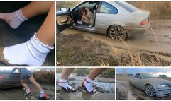 Real estate agent for her powerful BMW stuck in deep mud