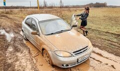 CAR STUCK Realtor Tanya is stuck in the mud