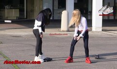 Two girls in classic Buffalo boots on model cars (0143n)