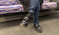 Candid shoeplay on the London Underground Train