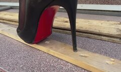 Louboutin crush, high heels bending, one heel standing, high heels crush, sinking heels into wooden planks