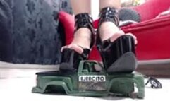 crushing a military jeep barefeet and in sexy heels and wooden sandals