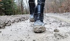 Very dirty Dr Martens boots walking in mud