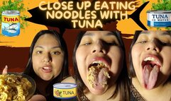 Close up eating noodles with tuna