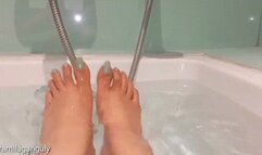 Feet Play In Water Wearing Minty Blue Nail Color On Long Toenails