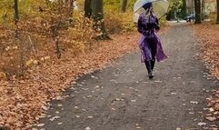 Rubbermissy Park stroll in purple rubber catsuit and shiny transparent PVC Rainmac raincoat