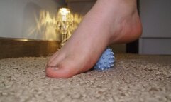 Playing with feet and massage ball: blue relax