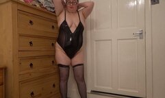 striptease in PVC bodice and fishnet holdup stockings