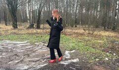 A girl in sexy high-heeled shoes deliberately decided to walk along a dirty forest path, dirtying her heels and destroying them