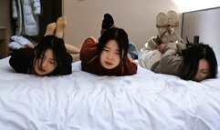 Three curious girls experience rope bondage for the first time in a hotel