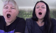 Blonde and brunette yawn widely a