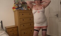 Sexy nurse striptease in skin tight uniform fishnet stockings