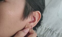 Ear with fetish piercing