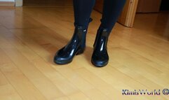 Rubber ankle boots and tan pantyhose