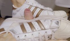 Shoejob with well-worn Adidas Superstar