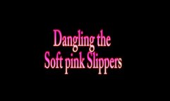 Dangling the soft pink Slippers