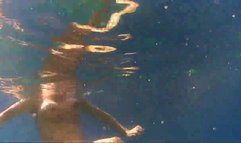 Nude girl filmed under water