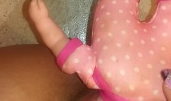 Girl stuffs baby doll head in pussy