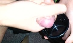 Filling a cup with fresh semen