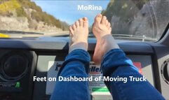 Feet on Dashboard of Moving Truck