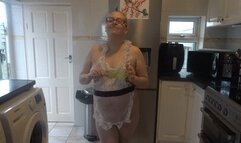 Naughty french maid Pinafore playing with utensil