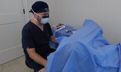 Doctor Nick wears surgical PPE and performs exam on his female patient