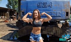 Kim flexes her beautiful muscles at the junkyard