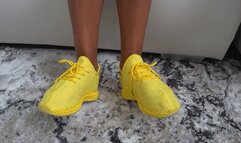 toe wiggleling in yellow soft sneakers c