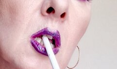 Extreme close up smoke EVE 120s with purpel lips, eye make up and bra