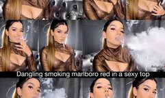 Dangling smoking marlboro red in a sexy low cut top, ponytail, hoops and nude glossy lips!
