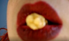 My red lips play with the popcorn
