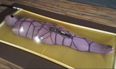 Lilac nylon cocoon and lilac rope bondage with vibro in a latex bed