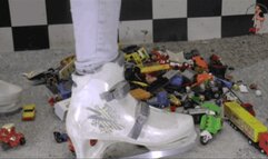 Toy cars and toy stuff under ice skating shoes
