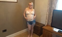 Dancing striptease in shorts and lace top