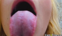 Blonde swallows rubber cock and gags hard