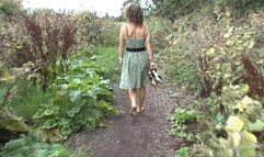 Zoe wandering barefoot along muddy path