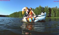 Alla wears an inflatable swimming vest and swims on the lake and climbs on an inflatable swan!!!