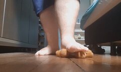 Giant feet crushing a teddy bear