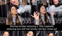 Alluring smoker enjoying a 120s cigarette in her snake skin top seducing you with her smoky red lips close up!
