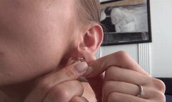 EAR PULLING AND PIERCE THE EAR LOBES WITH NEEDLE and THREAD