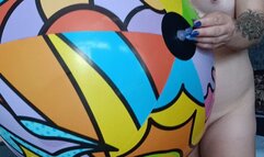 girl sittopop on bestway beachball