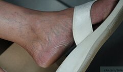 Candid dangling sandals, wrinkled nice mature feet moving continuously, foot fetish watching