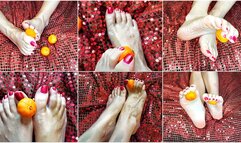 The feet are playing with a tangerine