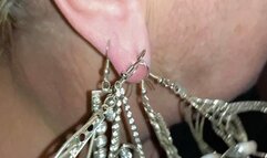 Many heavy earrings on one earlobe MP4