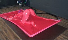 Experiments in a pink latex vacuum bed with poses